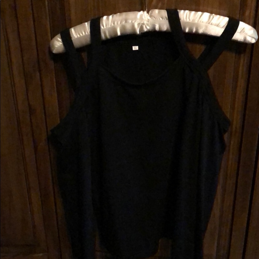 Long sleeve shirt with cut outs at shoulder.